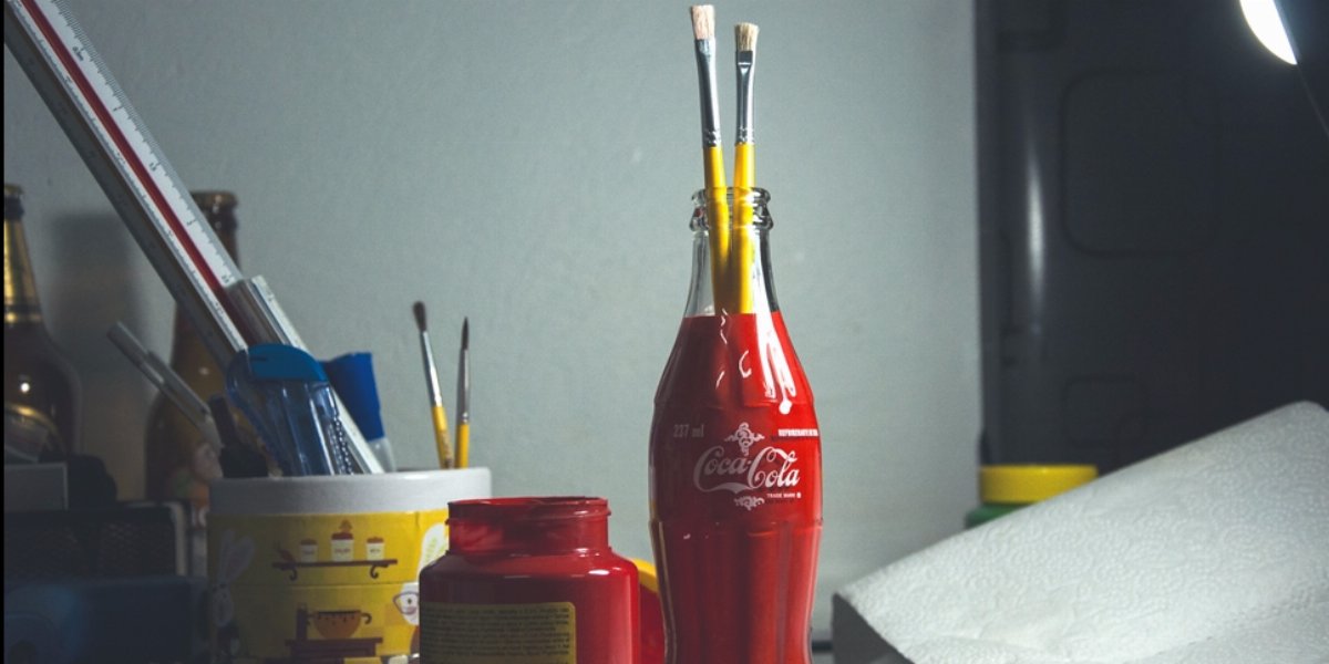 Reusing a Coke bottle as pencil holder.