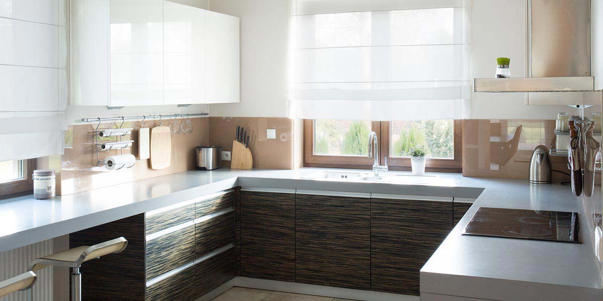 Clean, Modern Kitchen With Sleek White Counters.