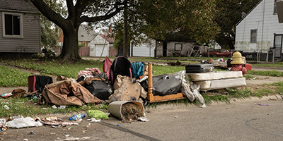 Pile of Household Junk and Debris in Front Yard