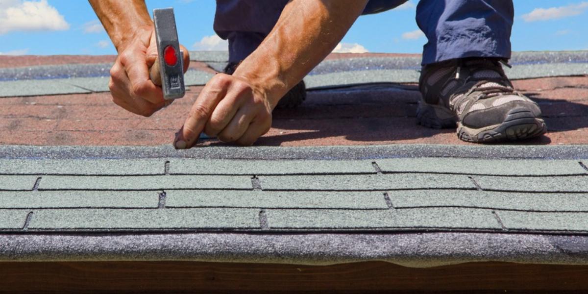 Installing a new roof on a house.