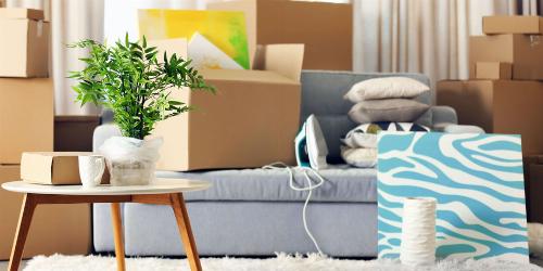 Living room full of moving boxes.