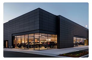 A car dealership at night.