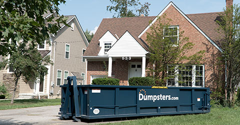 Dumpsters.com Roll Off Dumpster in Front of House