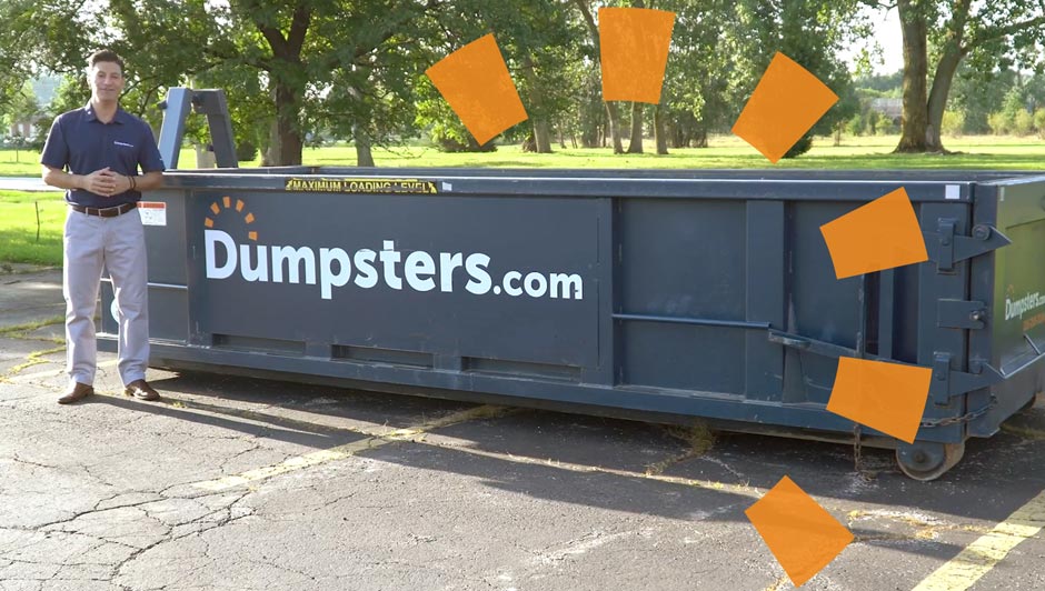 Person Standing in Front of Dumpsters.com Dumpster