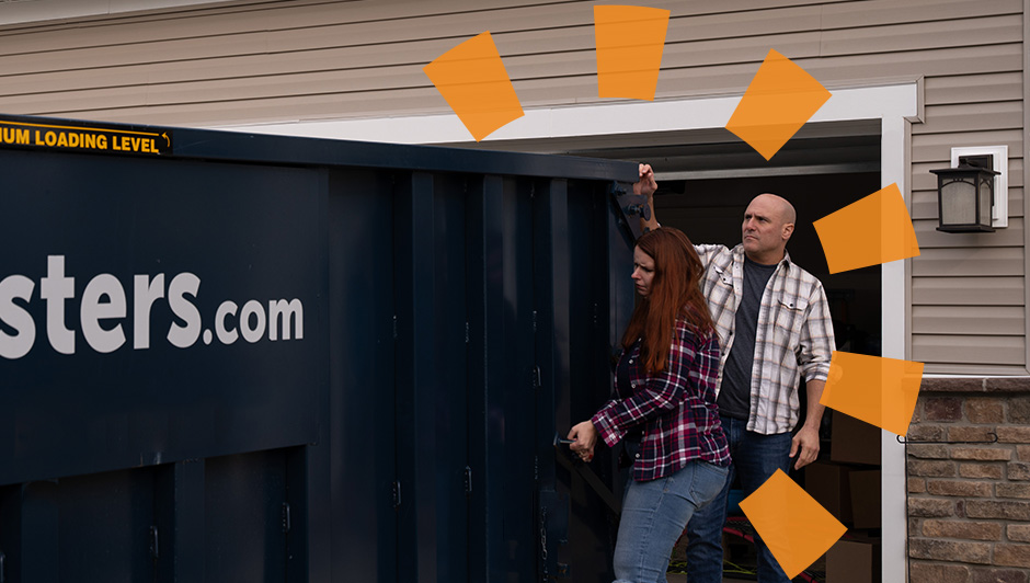 Couple With Dumpsters.com Dumpster in Driveway