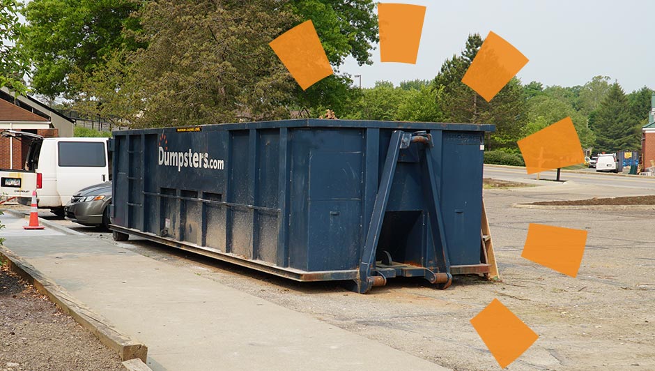 Large Blue Dumpster in Driveway