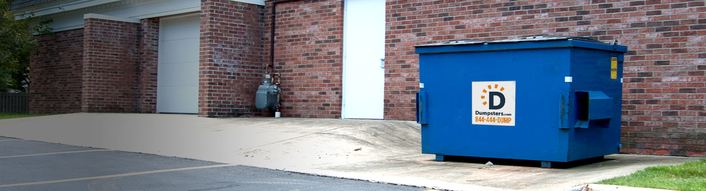 Dumpster behind a retal store.