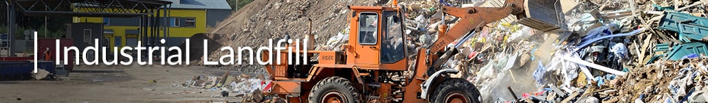 A Front-End Loader Sifts Through Construction Debris at an Industrial Landfill.