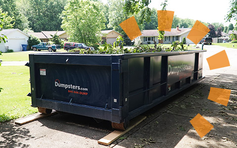 Dumpsters.com yard waste roll off dumpster full of landscaping debris