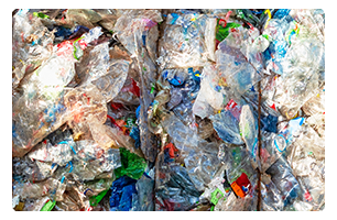 Bundles of plastic and paper packaging ready for disposal.