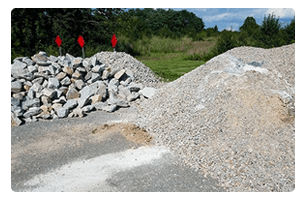 A pile of rocks and a pile of gravel.