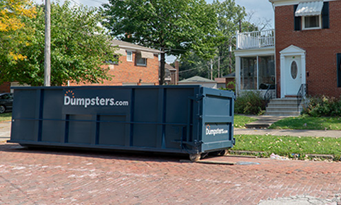 Side View of a Blue Temporary Dumpster With a Dumpsters.com Logo