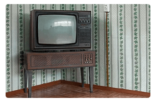 An old tube TV in a corner.